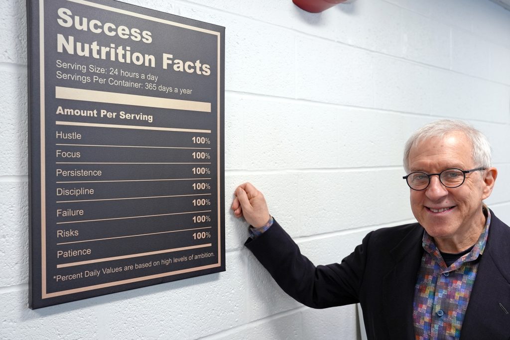 portrait in front of the Nutrition Facts plaque