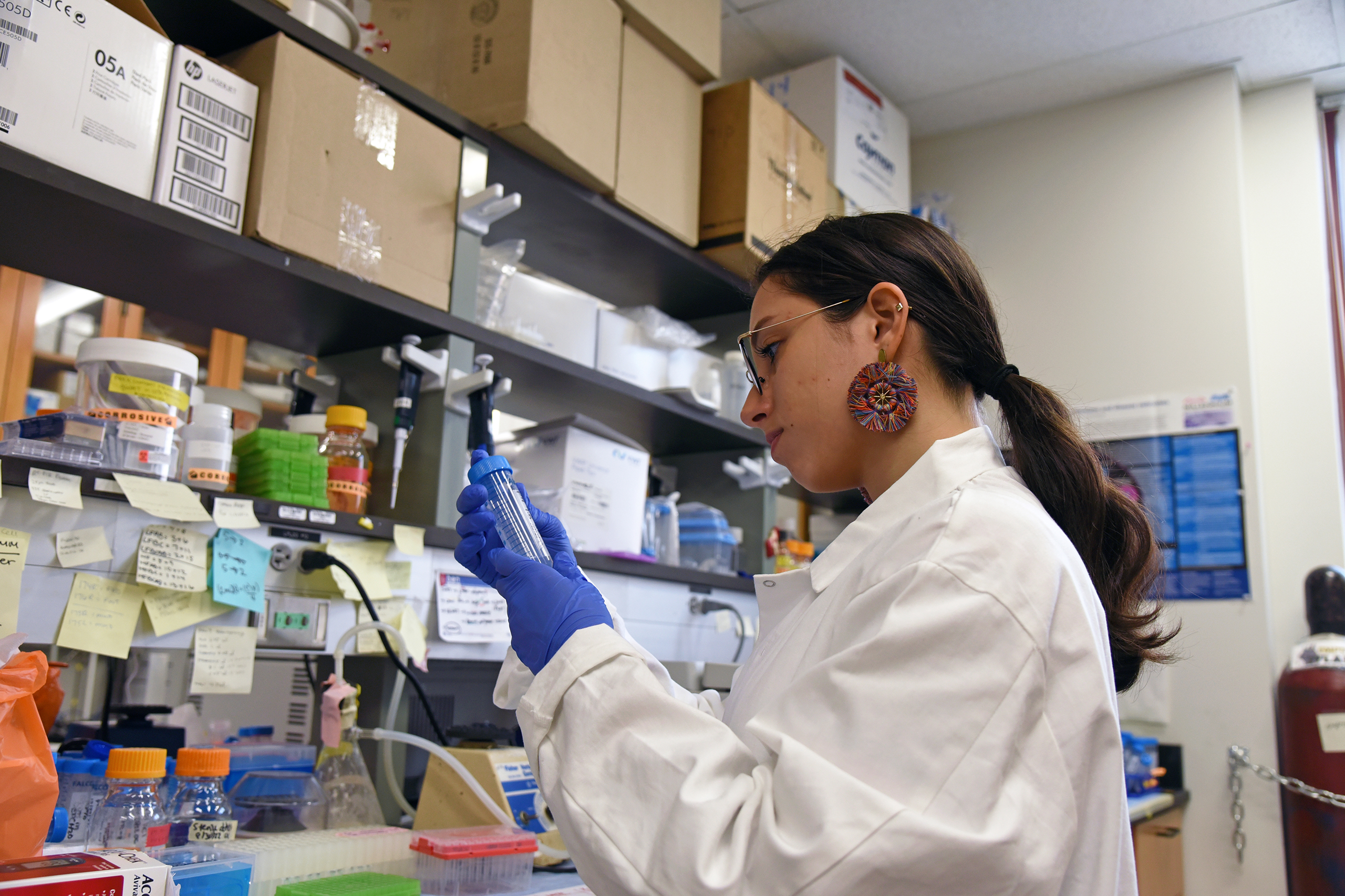 researcher looking at samples in the lab